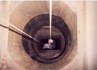 Descending Ring Shaft on an abseiling rope. The second rope is the guidewire for the buckets being raised
