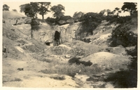 Picture from 1923 of entrance with rough fence