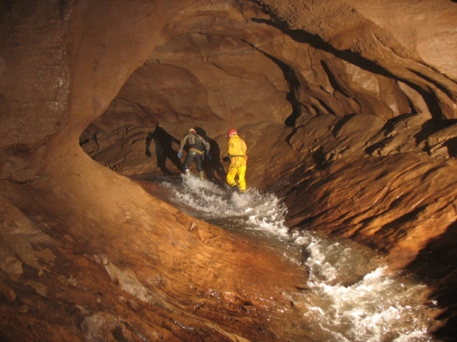 The main streamway in Peak Cavern, Derbyshire - a classic river passage
